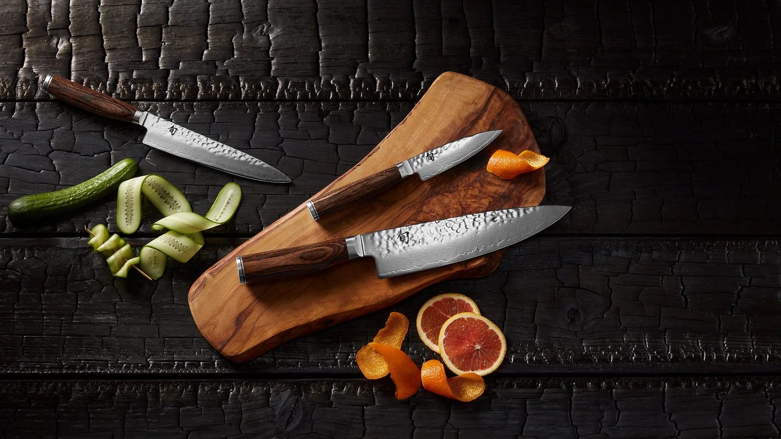 Shun Premier knives arranged on a dark surface